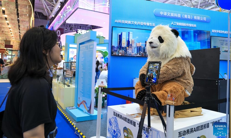 A visitor interacts with a robotic panda at the 22nd China (Shenzhen) International Cultural Industries Fair in Shenzhen, south China's Guangdong Province, May 22, 2026. The 22nd China (Shenzhen) International Cultural Industries Fair kicked off on Thursday in the metropolis of Shenzhen.
The five-day event, which highlights cultural industry development, focuses on the digital intelligence empowerment of the industry and the cultivation of new quality productive forces, gathering domestic and foreign high-end cultural industry resources and innovation elements. Photo: Xinhua