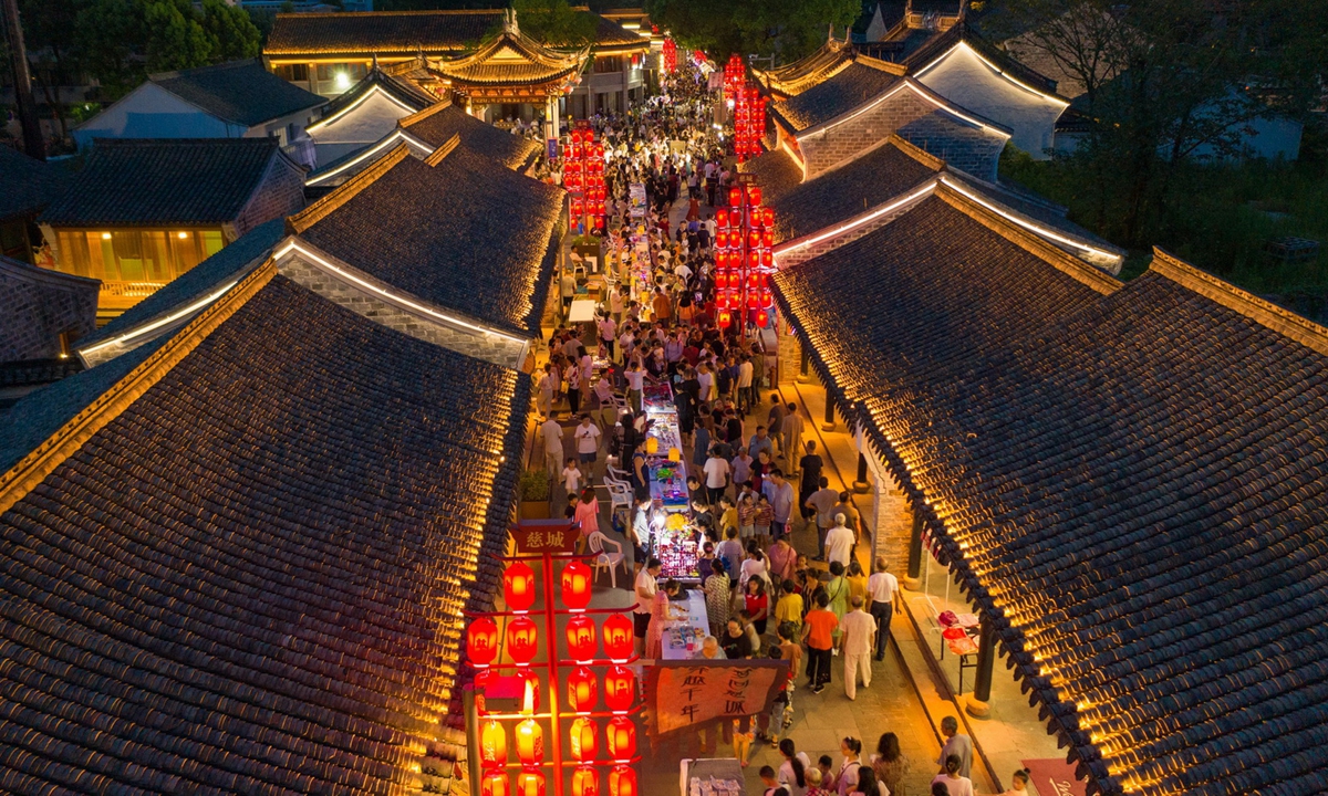 People stroll around a night market at Cicheng Ancient Town. Photo: Courtesy of Shen Guofeng