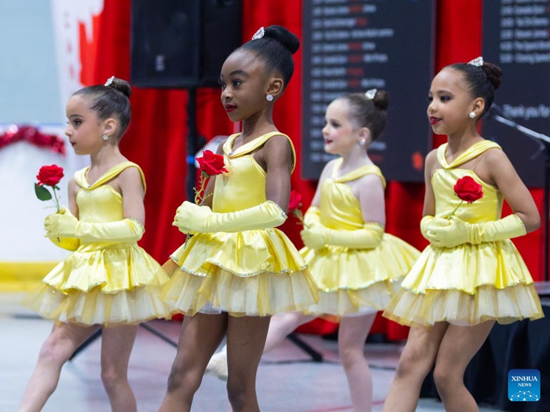 Children dance during the 2026 Carassauga Festival of Cultures in Mississauga, Ontario, Canada, May 23, 2026. The two-day annual cultural event kicked off here on Saturday, featuring diverse cuisine, stage shows and interactive experiences. (Photo by Zou Zheng/Xinhua)