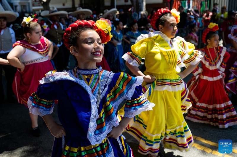 Artists perform in a parade during the Carnaval San Francisco in San Francisco, the United States, May 24, 2026. (Photo by Ziyu Julian Zhu/Xinhua)
