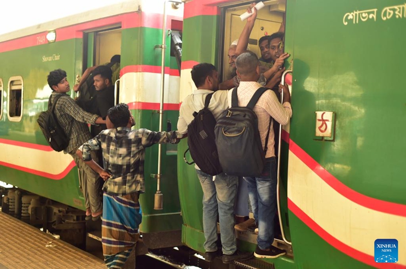 People are pictured during the Eid al-Adha travel rush at Kamalapur Railway Station in Dhaka, Bangladesh, May 24, 2026. As Eid al-Adha approaches, many people from Dhaka have streamed out of the city to join the festival with their kith and kin in hometowns. (Photo by Habibur Rahman/Xinhua)