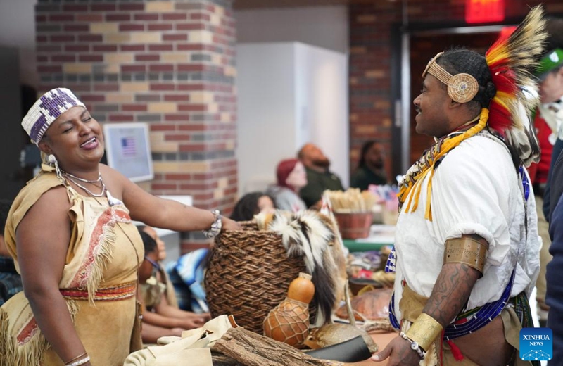 People reenact life of Native Americans during the Re-enactment Village event in Long Island of New York, the United States, on May 23, 2026. An event titled the Re-enactment Village kicked off in New York on Saturday to recreate the daily life of 18th-century. (Xinhua/Zhang Fengguo)