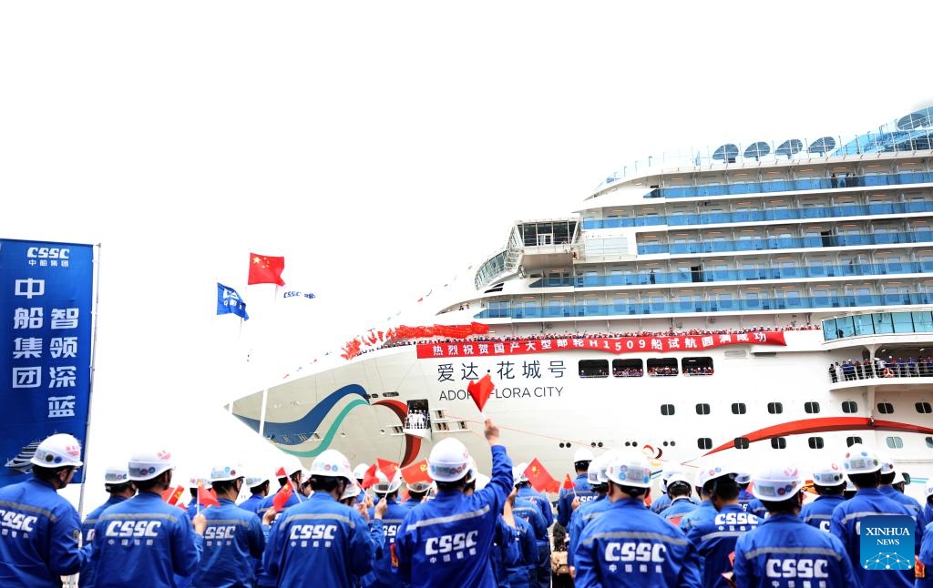 Staff members welcome the return of the cruise ship Adora Flora City after a sea trial, at a port in east China's Shanghai, May 27, 2026. China's second domestically built large cruise ship, the Adora Flora City, returned to port in Shanghai on Wednesday after completing a 12-day maiden sea trial, marking a milestone in the country's push to mass-produce large cruise ships. The ship is scheduled for delivery on November 6 and will operate international routes from the Nansha International Cruise Home Port in Guangzhou, capital of south China's Guangdong Province. (Photo: Xinhua)