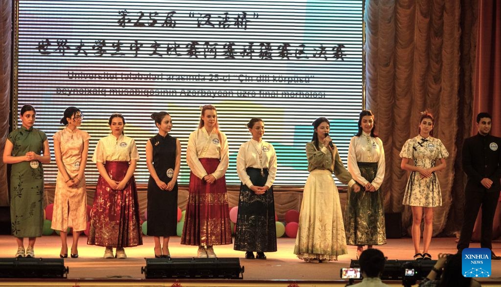 Ten contestants pose for a group photo during the final of the 25th Chinese Bridge Chinese Proficiency Competition for Foreign College Students in Azerbaijan in Baku, Azerbaijan, May 25, 2026. The final of the 25th Chinese Bridge Chinese Proficiency Competition for Foreign College Students in Azerbaijan was held on Monday in Baku. The competition, organized by the Chinese Embassy in Azerbaijan and hosted by the Confucius Institute at Baku State University (BSU), featured 10 finalists from BSU and the Azerbaijan University of Languages. (Photo: Xinhua)