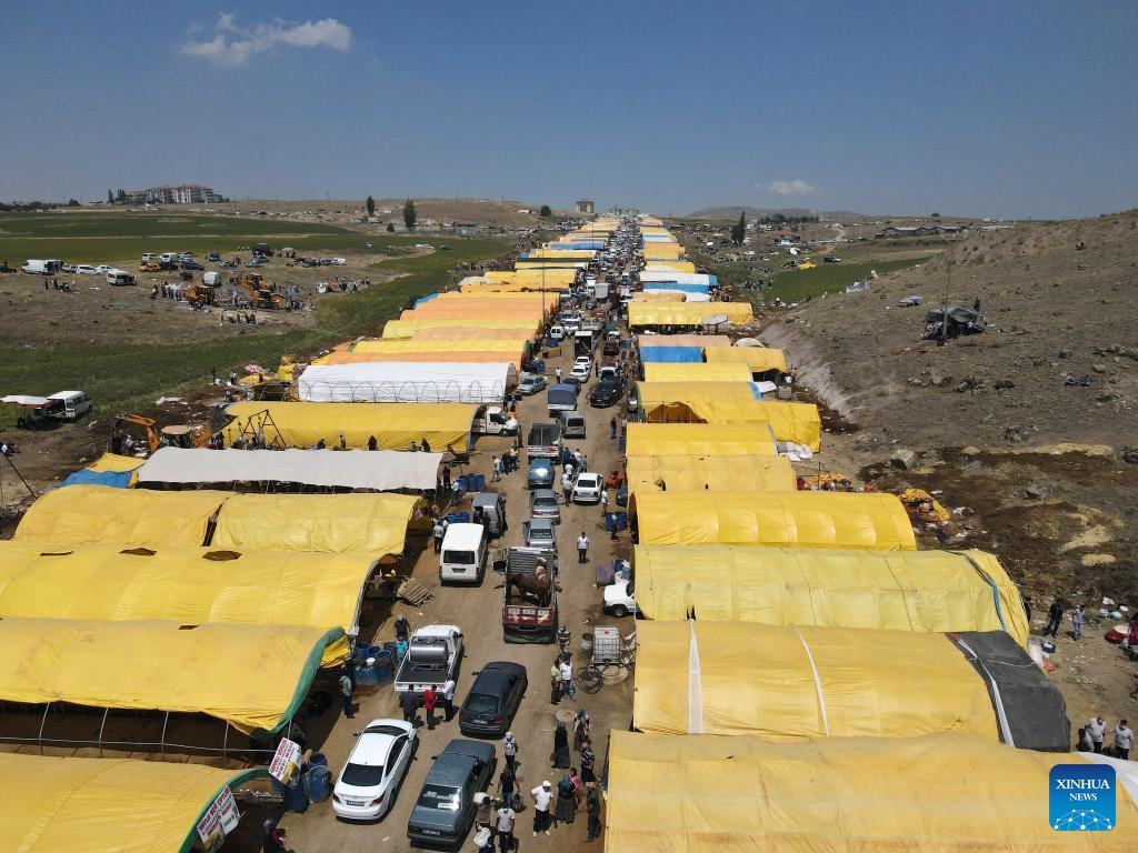 A drone photo taken on May 27, 2026 shows a view of a large livestock market during Eid al-Adha outside Ankara, Türkiye. Eid al-Adha traditionally involves the sacrifice of livestock and the distribution of meat to relatives, neighbors, and those in need. The Muslim holiday Eid al-Adha will be celebrated in Türkiye between May 27 and 30. (Photo: Xinhua)