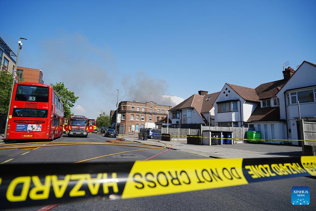 Police cordon off the scene after a fire broke out at a supermarket in Golders Green, London, Britain, May 27, 2026. A large fire broke out at a supermarket early Wednesday in Golders Green, an area in northwest London known for its large Jewish community, prompting a major emergency response and road closures, according to the London Fire Brigade. (Photo: Xinhua)