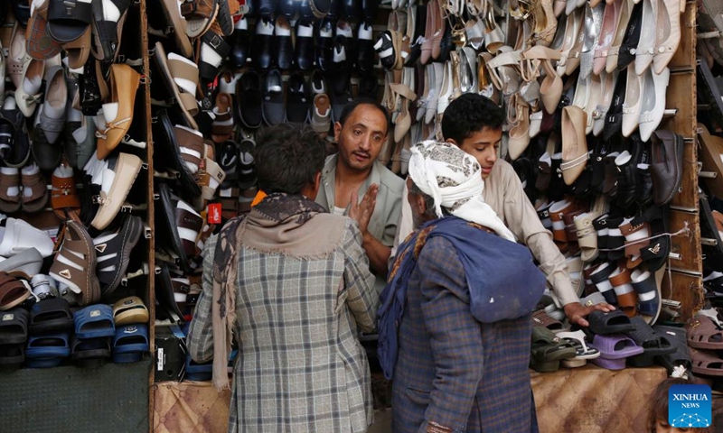 Yemenis buy new shoes before the upcoming Eid al-Adha at a market in Sanaa, Yemen, May 25, 2026. (Photo: Xinhua)