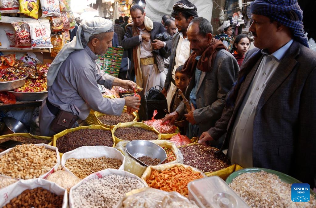 Yemenis buy sweets and nuts before the upcoming Eid al-Adha at a market in Sanaa, Yemen, May 25, 2026. (Photo: Xinhua)