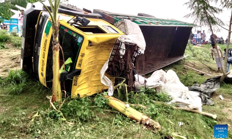 This photo taken on May 25, 2026 shows a scene at the site of a truck accident in Tangail district, Bangladesh. At least 15 people were killed, and six others injured early on Monday when a rod-laden truck overturned into a bridge-side ditch in Bangladesh's Tangail district, some 97 km away from the capital Dhaka. (Photo: Xinhua)