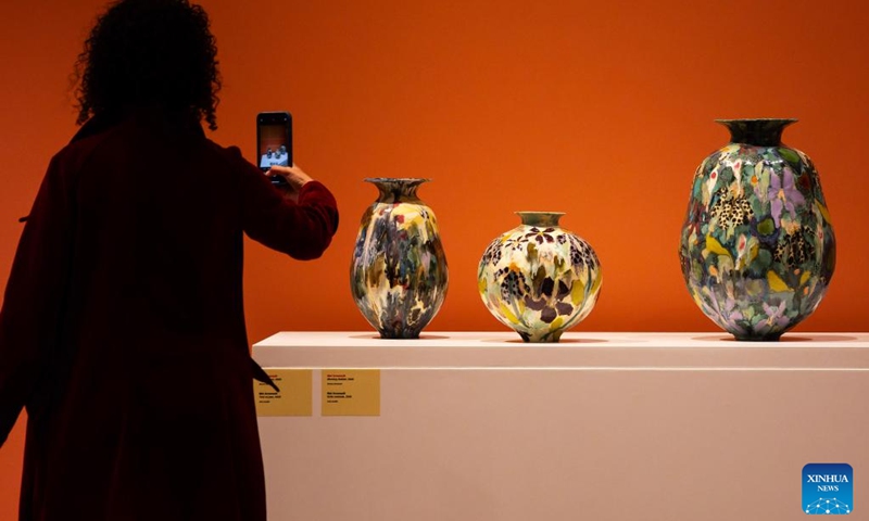 A woman films artworks during the media preview of the International Ceramic Art Fair 2026 at the Gardiner Museum in Toronto, Canada, May 27, 2026. Featuring innovations and contemporary trends in ceramic art, this biennial exhibition opens to the public from May 28 to August 16. (Photo: Xinhua)
