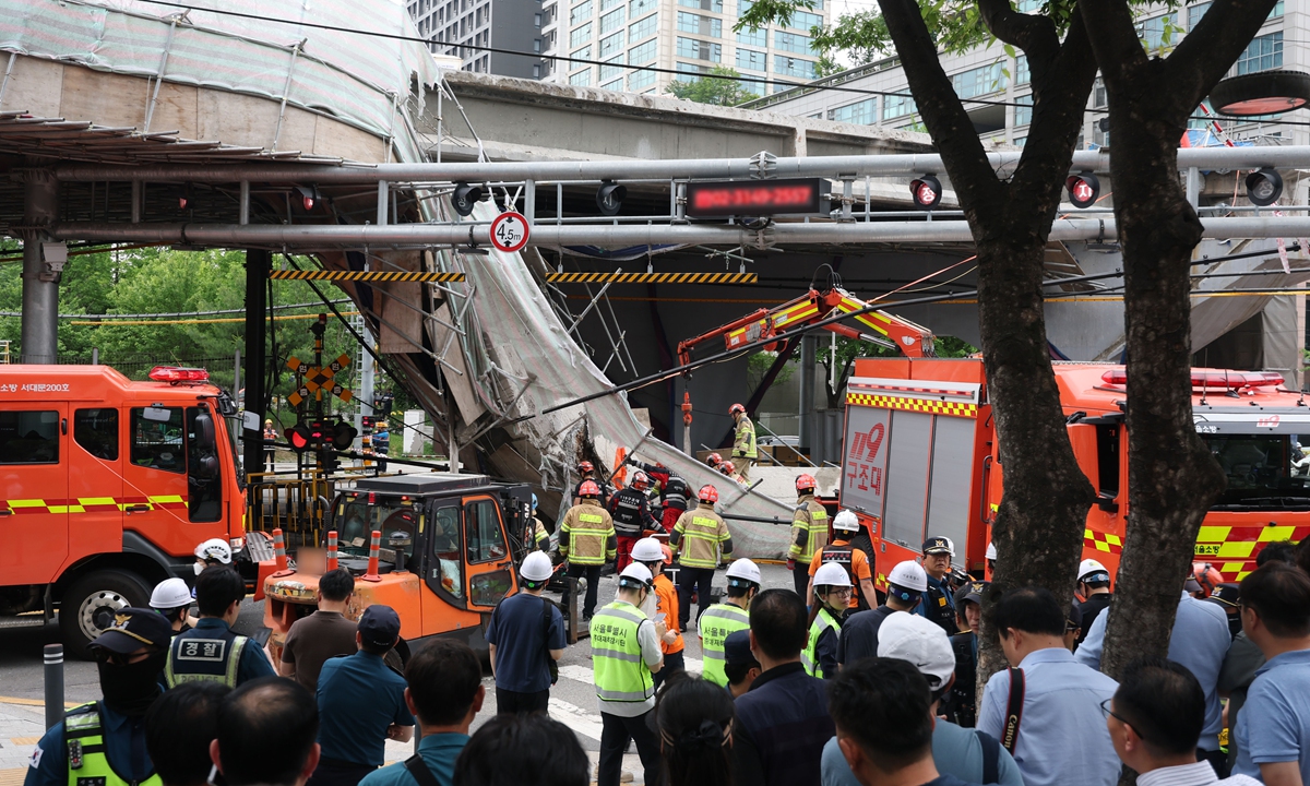 The fire crews inspect the scene after a section of the upper deck collapsed at the overpass demolition site in Seoul, South Korea, on May 26, 2026. Three people were killed and three others were injured in the accident, Xinhua reported, citing Yonhap news agency. Photo: VCG