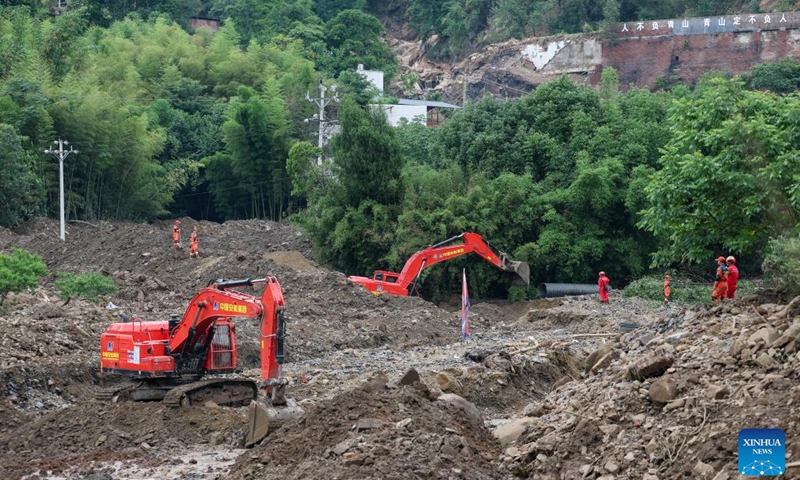 Rescuers work at the rescue site in Anxi Village of Yongchuan District, southwest China's Chongqing Municipality, May 26, 2026. From Saturday night to early Sunday morning, a sudden and extreme catastrophic rainstorm struck Yongchuan, triggering flash floods and geological disasters in multiple areas of this district. (Photo: Xinhua)