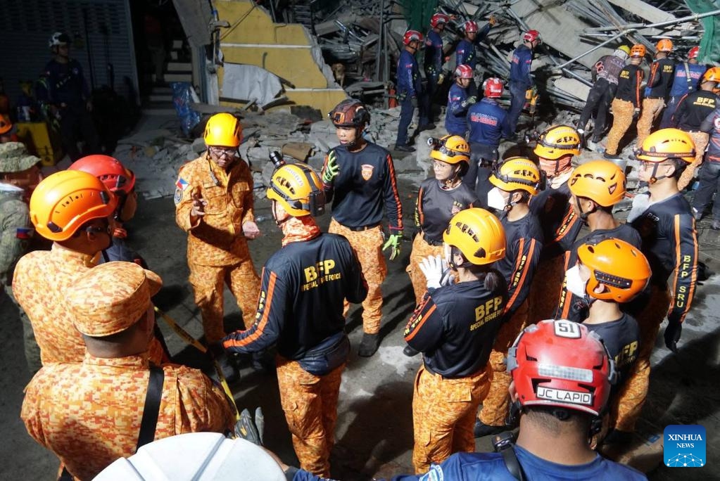 Rescuers search for survivors at the site of a collapsed building in Angeles City, Pampanga province, the Philippines, May 24, 2026. Four people were confirmed dead after a building collapsed before dawn Sunday in Angeles City in northern Philippines' Pampanga province, as search and rescue operations continue for 17 missing people, authorities said Monday. (Photo: Xinhua)