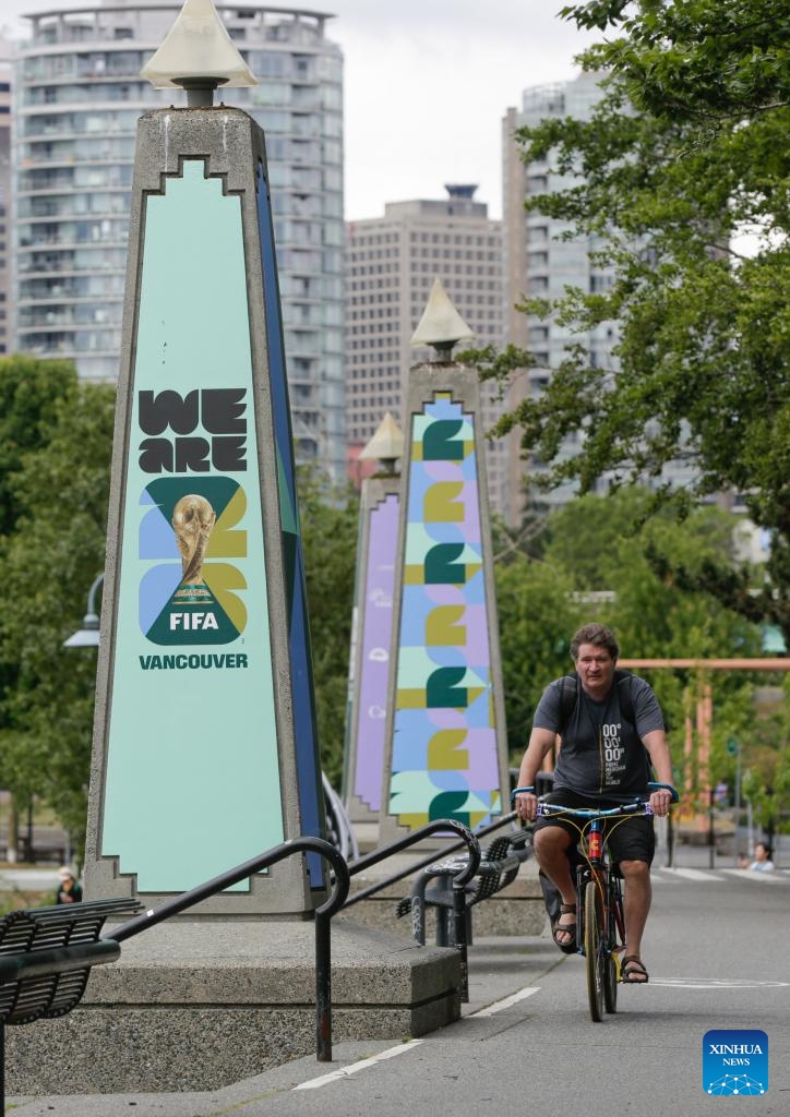A man cycles past FIFA World Cup 2026 signage in Vancouver, Canada, on May 26, 2026. (Photo: Xinhua)