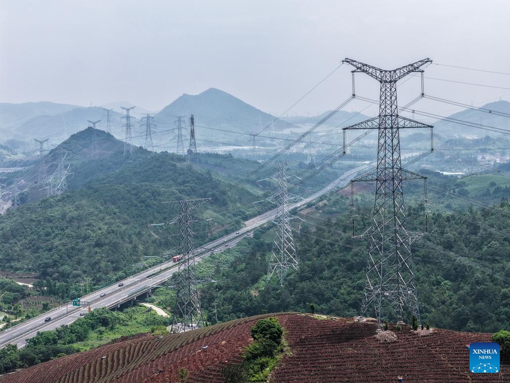 A drone photo taken on May 27, 2026 shows the power lines at Heping Town of Changxing County, Huzhou City of east China's Zhejiang Province. In recent years, State Grid Huzhou power supply company has been constantly promoting the upgrading of the county-level power grids, advancing the integration of renewable energy sources into power grids, and endeavoring to construct a safer, greener and smarter power grid. (Photo: Xinhua)