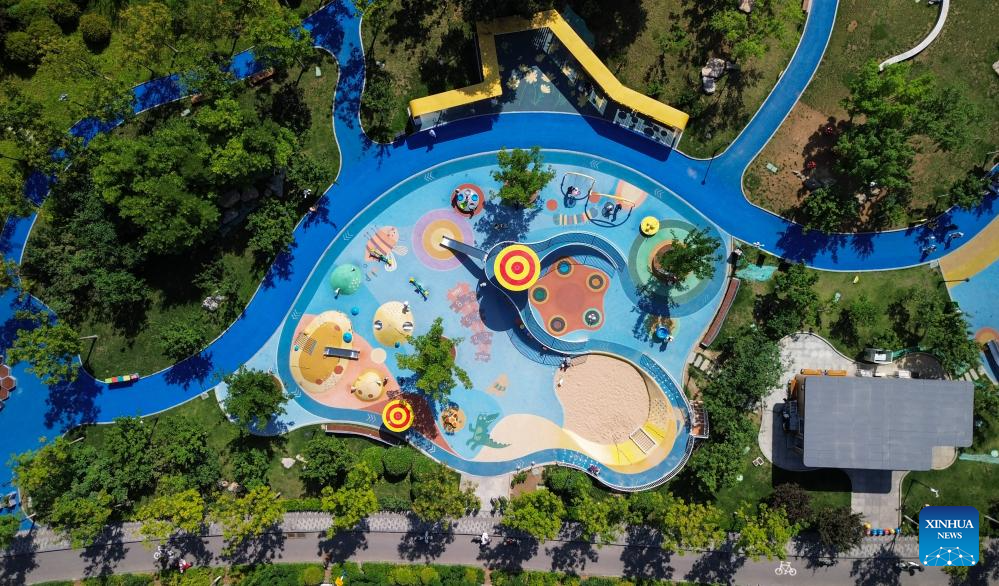 An aerial drone photo taken on May 28, 2026 shows a child-friendly park in Jinan, east China's Shandong Province. In recent years, Jinan has built more than 30 child-friendly parks to support the healthy growth of children. (Xinhua/Xu Suhui)