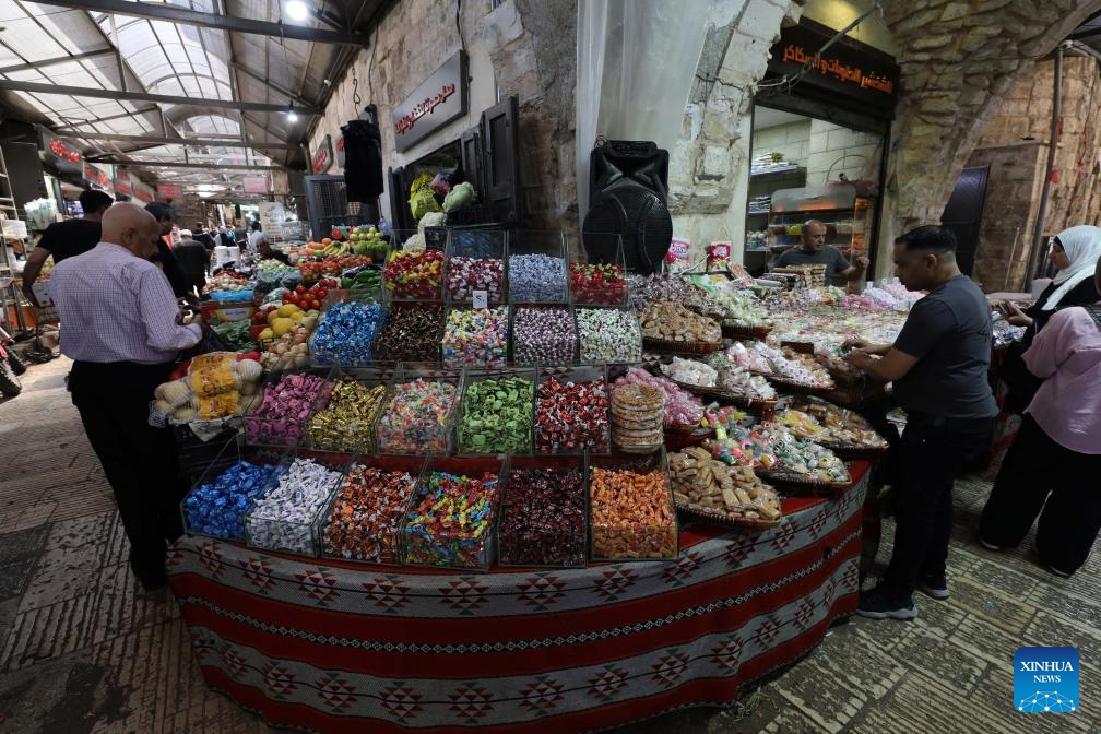 Palestinians shop for the upcoming Eid al-Adha in the West Bank city of Nablus, May 25, 2026. (Photo: Xinhua)