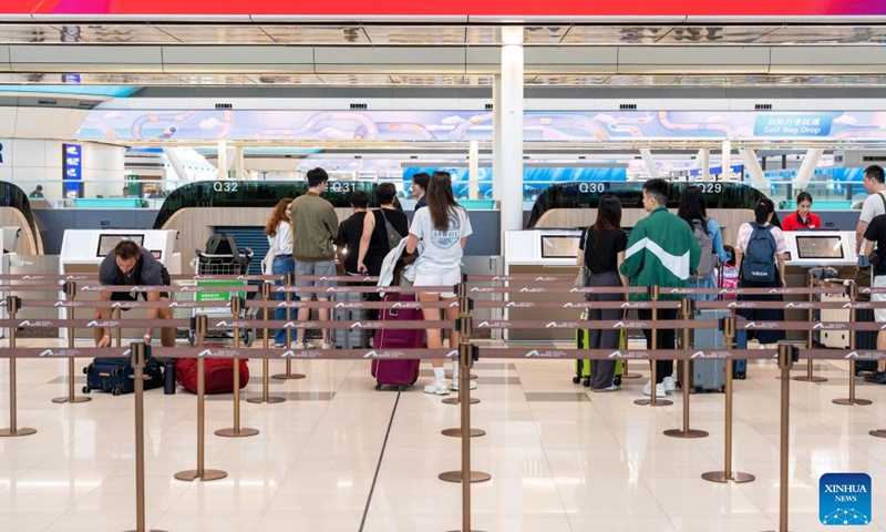 Passengers check in at the departures hall of Terminal 2 of Hong Kong International Airport in south China's Hong Kong, on May 27, 2026. Hong Kong International Airport's expanded Terminal 2 departures hall was officially put into operation on Wednesday following a 12.9 billion-Hong Kong-dollar upgrade. (Photo: Xinhua)