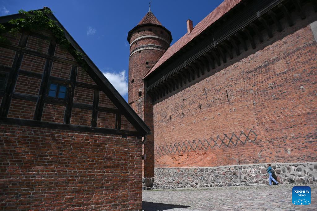 A red-brick tower inside the Olsztyn Castle is seen in Olsztyn, Poland, May 26, 2026. The city is known for its lakes and natural scenery. (Photo: Xinhua)
