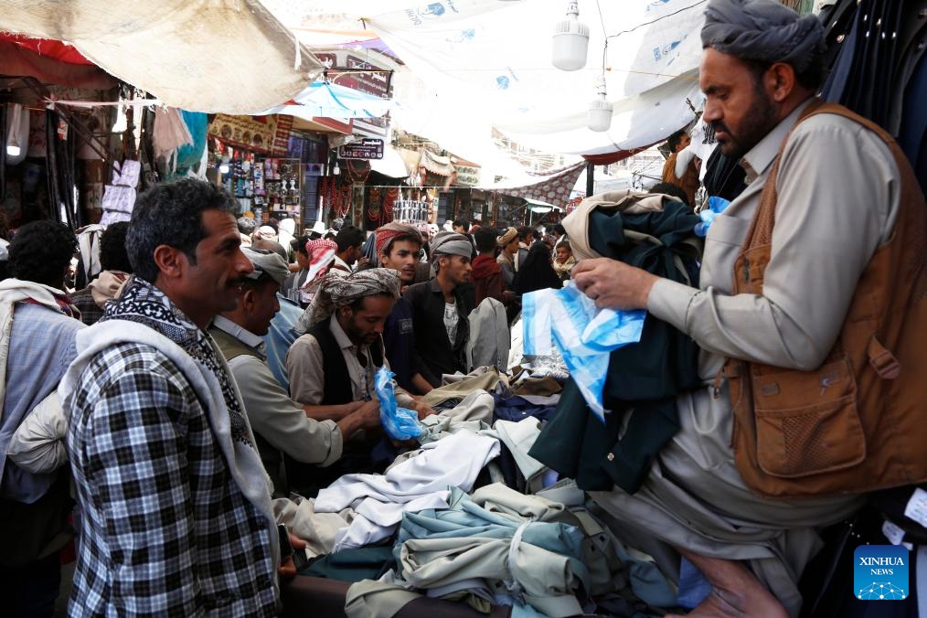 Yemenis shop for clothes before the upcoming Eid al-Adha at a market in Sanaa, Yemen, May 25, 2026. (Photo: Xinhua)