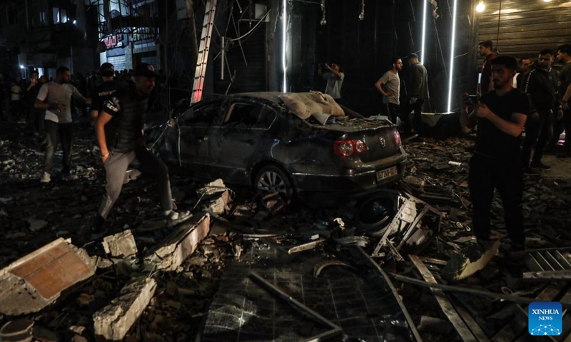 Palestinians inspect the aftermath of an Israeli bombing that targeted a residential building in the center of Gaza City, on May 26, 2026. (Photo: Xinhua)