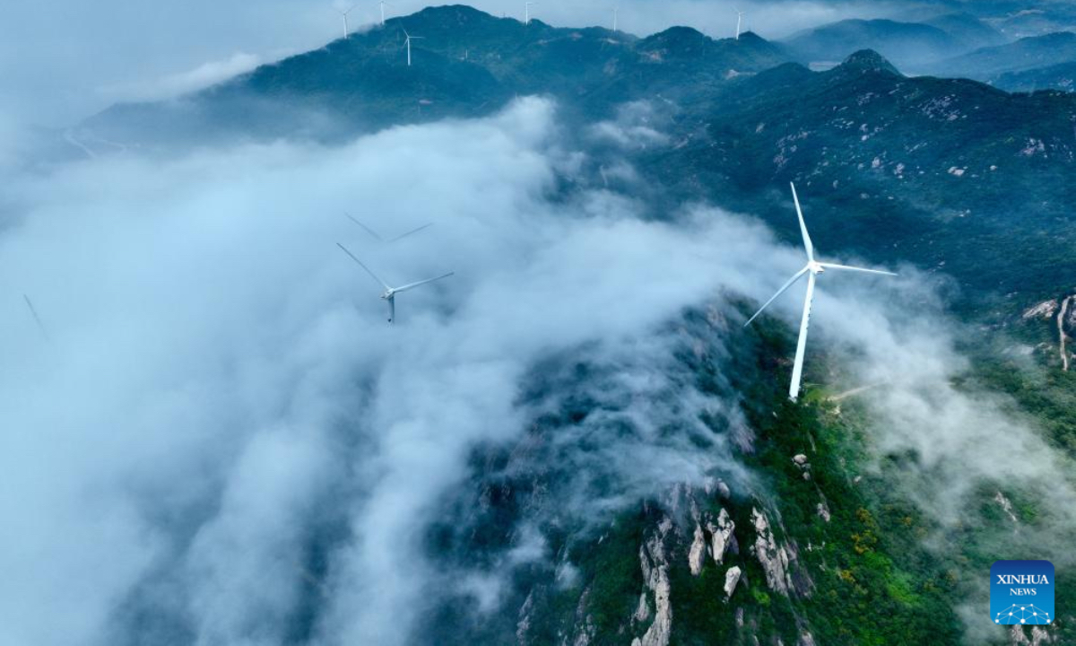 An aerial drone photo taken on May 27, 2026 shows a wind farm shrouded in fog in Lianjiang, southeast China's Fujian Province. (Xinhua/Jiang Kehong)