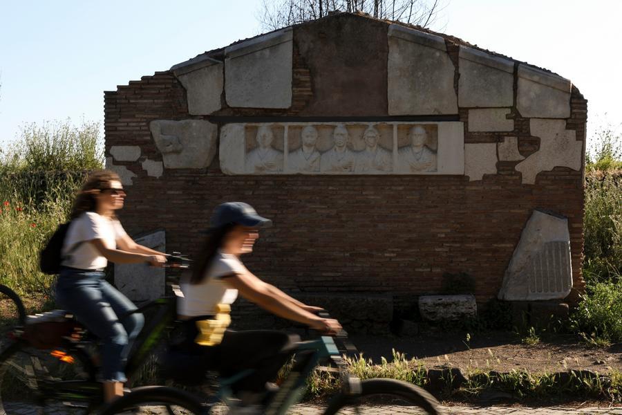 Cyclists ride past a historical site along the Appian Way in Rome, Italy, May 23, 2026. (Photo: Xinhua)