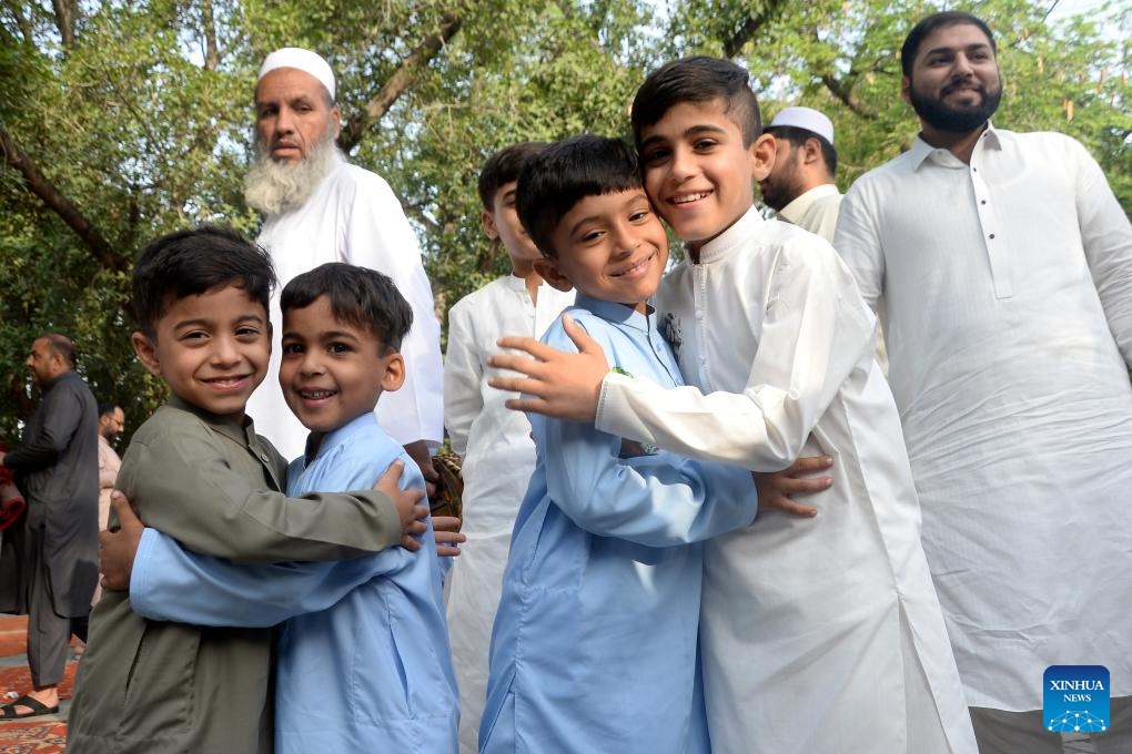 Children greet each other after Eid al-Adha prayers in Peshawar, Pakistan, on May 27, 2026. (Photo: Xinhua)