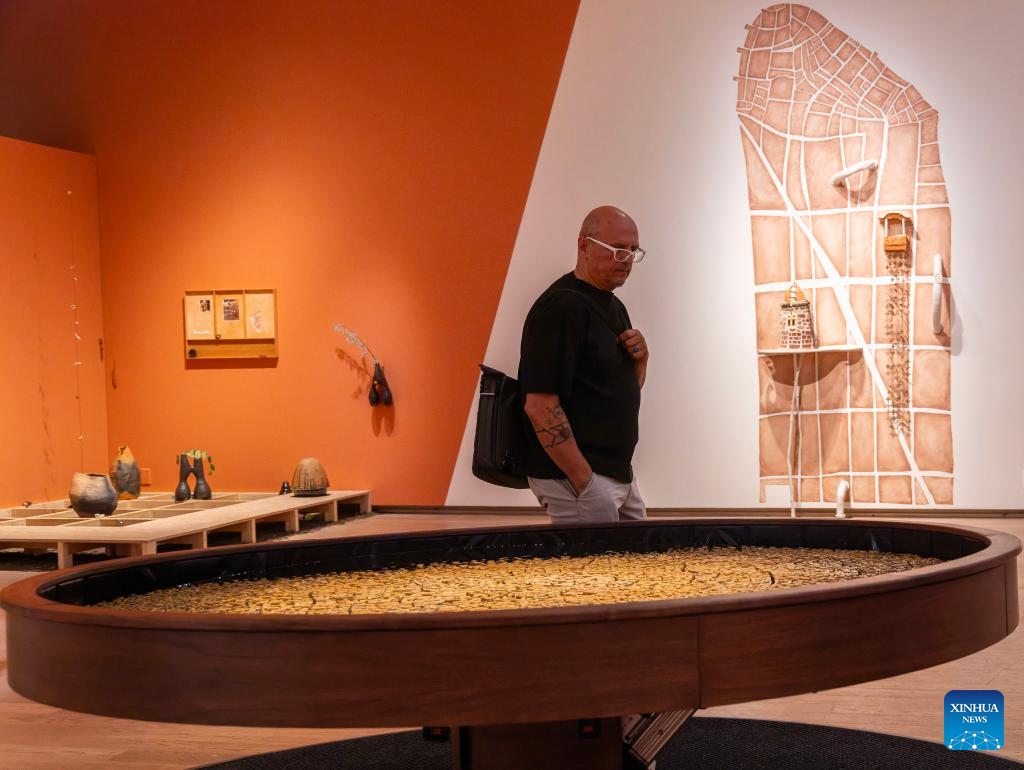 A man views artworks during the media preview of the International Ceramic Art Fair 2026 at the Gardiner Museum in Toronto, Canada, May 27, 2026. Featuring innovations and contemporary trends in ceramic art, this biennial exhibition opens to the public from May 28 to August 16. (Photo: Xinhua)