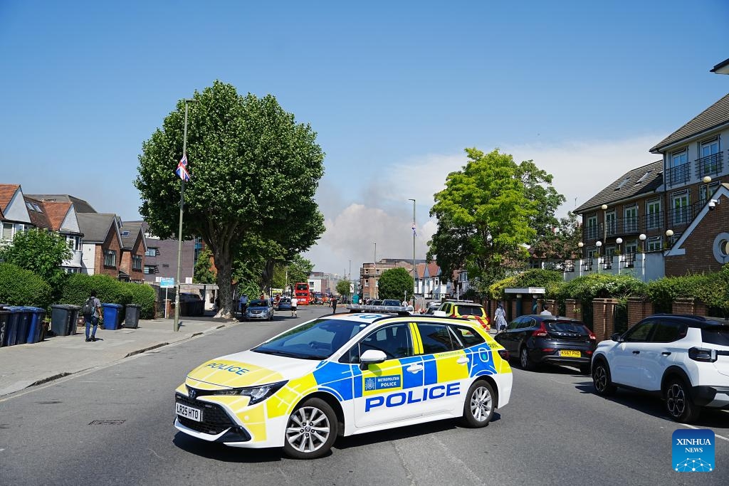 Police cordon off the scene after a fire broke out at a supermarket in Golders Green, London, Britain, May 27, 2026. A large fire broke out at a supermarket early Wednesday in Golders Green, an area in northwest London known for its large Jewish community, prompting a major emergency response and road closures, according to the London Fire Brigade. (Photo: Xinhua)