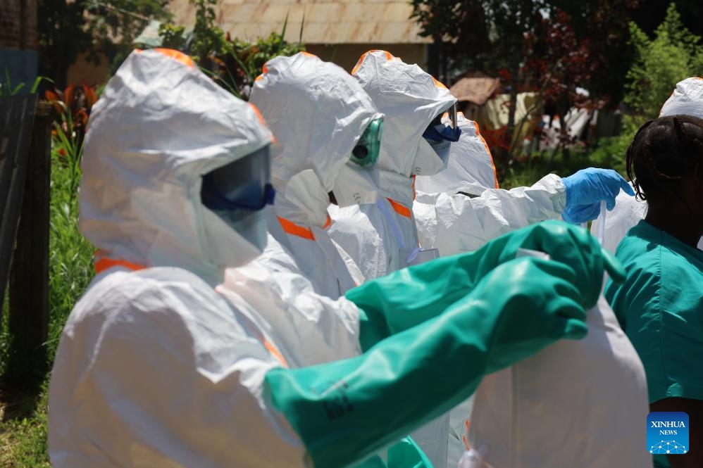 Medical workers wear protective suits before disinfecting work in Mongbwalu, Ituri province, the Democratic Republic of the Congo, May 24, 2026. The Ebola outbreak in the Democratic Republic of the Congo (DR Congo) remains at an early stage, but infections and deaths continue to rise, Health Minister Roger Kamba said Tuesday. (Photo: Xinhua)