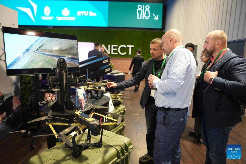 People watch drones during the Drone Summit 2026 in Riga, Latvia, May 27, 2026. (Photo: Xinhua)