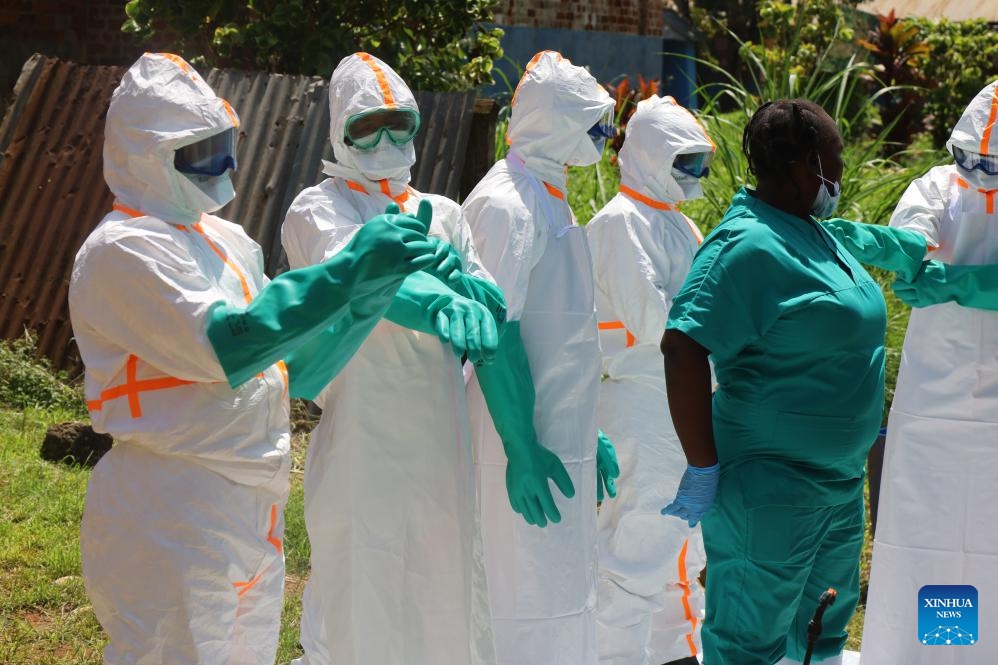 Medical workers wear protective suits before disinfecting work in Mongbwalu, Ituri province, the Democratic Republic of the Congo, May 24, 2026. The Ebola outbreak in the Democratic Republic of the Congo (DR Congo) remains at an early stage, but infections and deaths continue to rise, Health Minister Roger Kamba said Tuesday. (Photo: Xinhua)