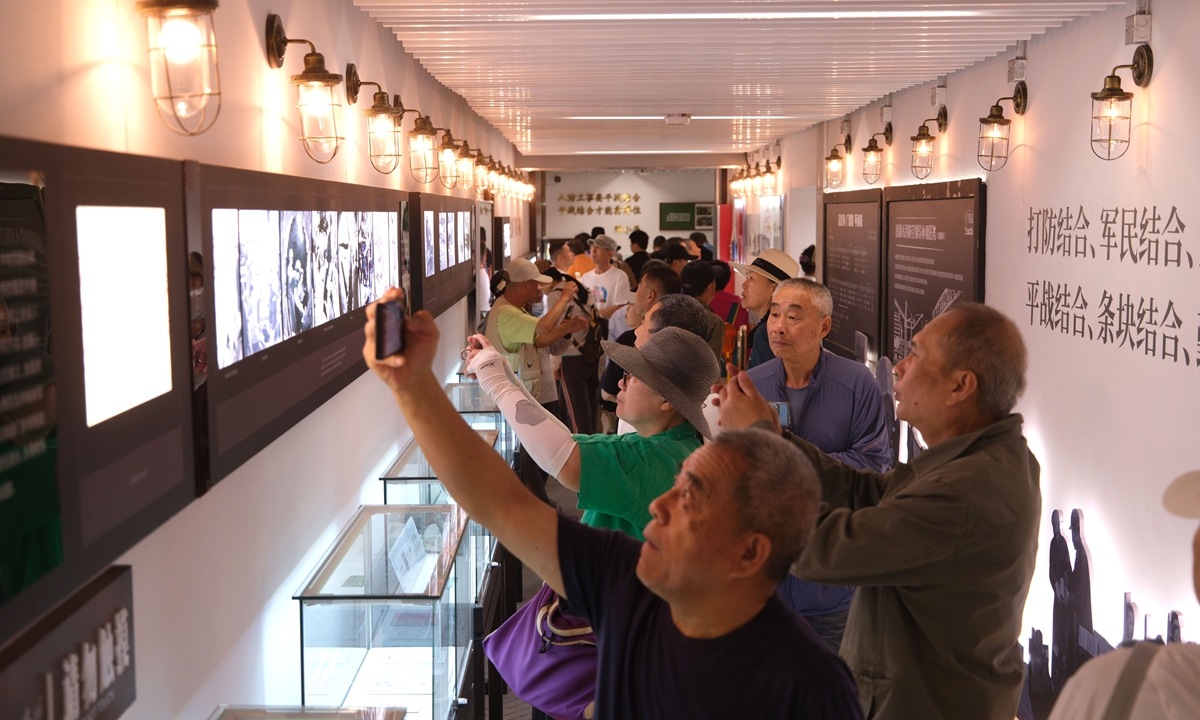 Visitors take photos at the Beijing Underground City on May 14, 2026.