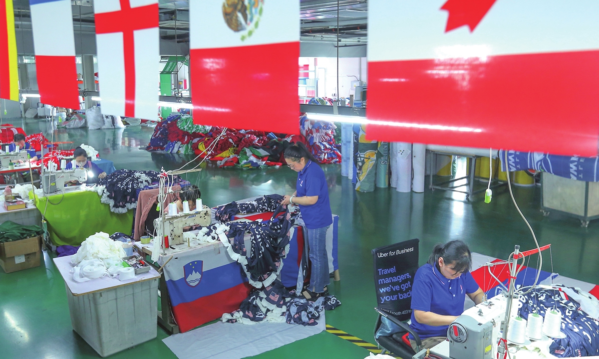 Workers make World Cup merchandise at a production workshop in Qingdao, East China's Shandong Province on May 28, 2026. The 2026 World Cup, which will be co-hosted by the US, Canada and Mexico, is scheduled to kick off on June 11. Photo: VCG