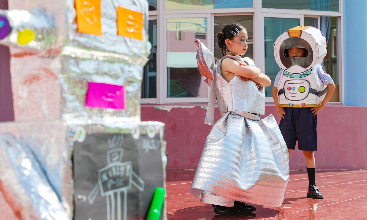 Children from a kindergarten in Huaibei, East China's Anhui Province, showcase their creative robot handicrafts made from waste materials on May 28, 2026. Photo: VCG
