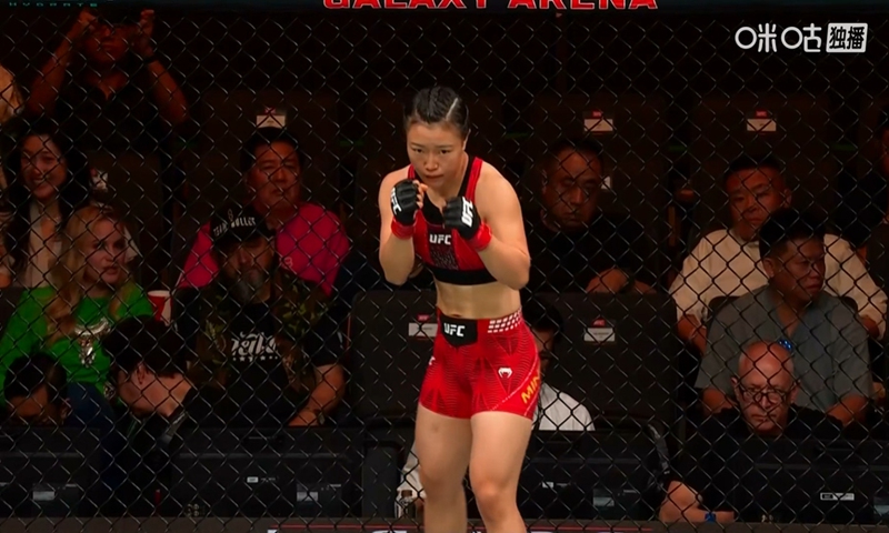 A screenshot of China's Shi Ming competing in the UFC strawweight bout against India's Puja Tomar on May 29, 2026