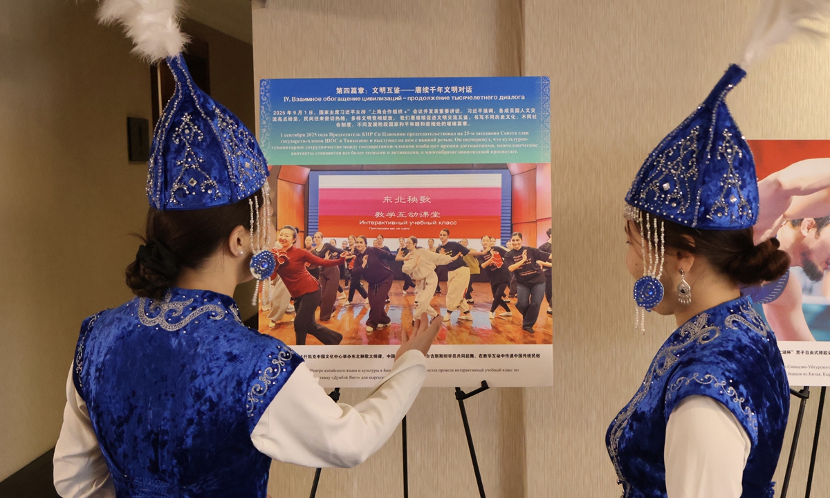 Guests view a photo at the 