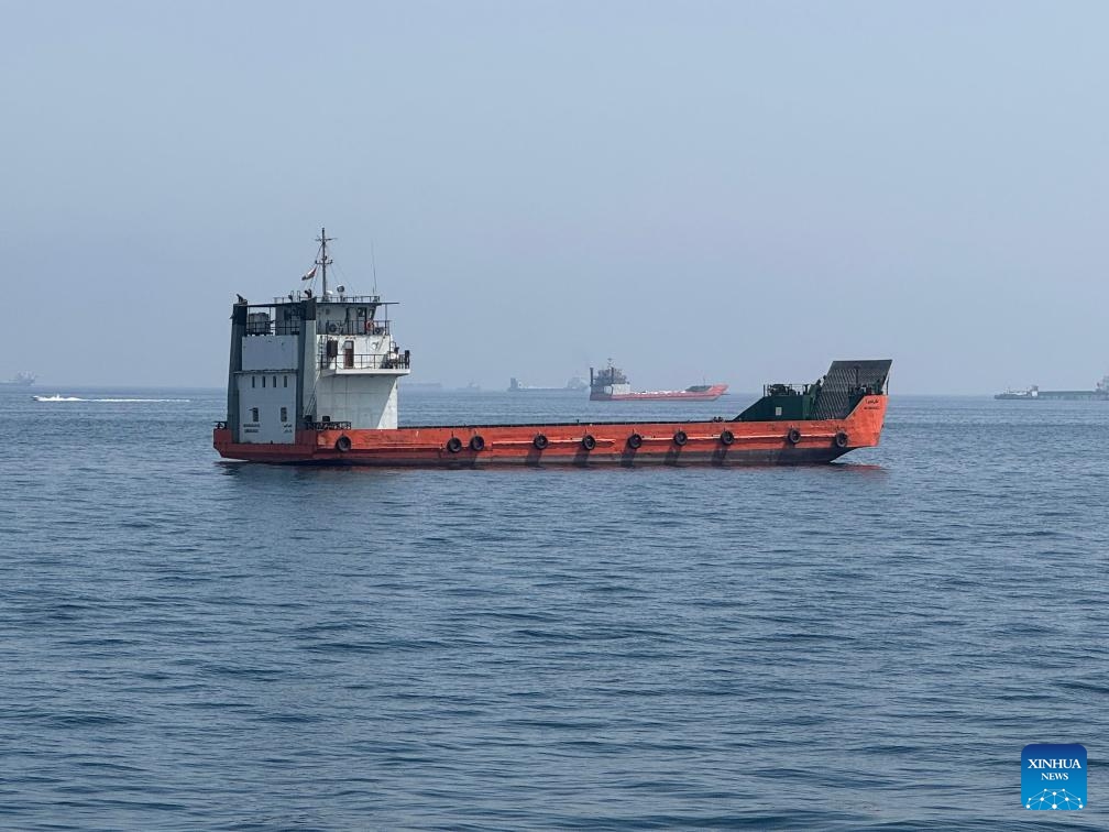 This photo taken with a mobile phone shows merchant vessels stranded in the waters of the Strait of Hormuz, near Khasab, a small town in northern Oman, May 29, 2026. (Photo: Xinhua)