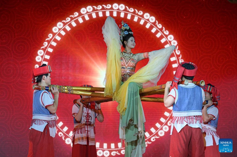 A performance is staged at a tourist attraction in Baoting, south China's Hainan Province, May 28, 2026. Rooted in the distinctive traditions of the Li and Miao ethnic groups, the tourist attraction features immersive night tour experiences as its core draw. (Xinhua/Pu Xiaoxu)