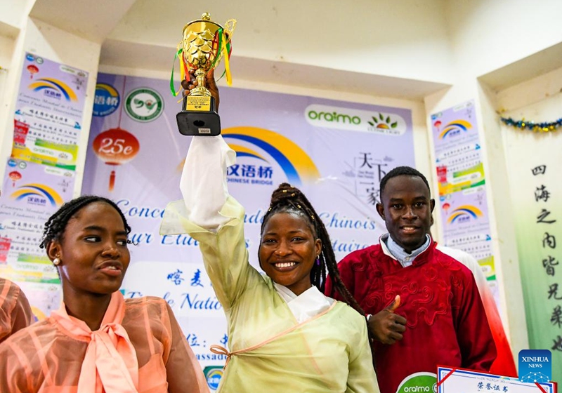 The champion of the 25th Chinese Bridge Chinese Proficiency Competition for university students in Cameroon celebrates after the final in Soa, Cameroon, May 29, 2026. The national final of the competition was held on Friday at the Confucius Institute of the University of Yaounde II in Soa. A total of 13 university students participated in the competition. Photo: Xinhua