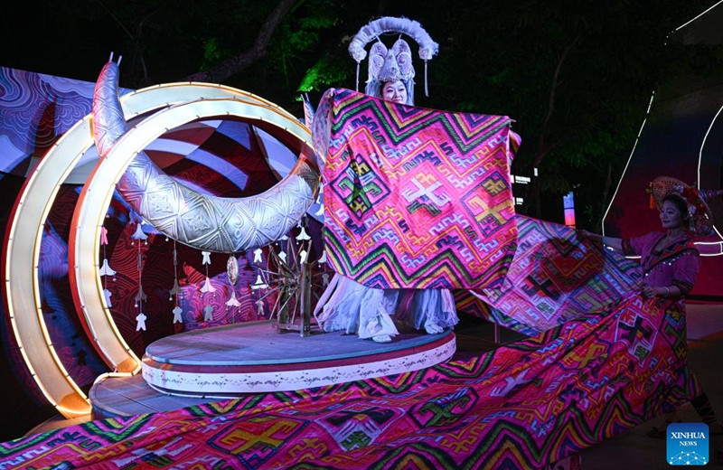 A performance is staged at a tourist attraction in Baoting, south China's Hainan Province, May 28, 2026. Rooted in the distinctive traditions of the Li and Miao ethnic groups, the tourist attraction features immersive night tour experiences as its core draw. (Xinhua/Pu Xiaoxu)