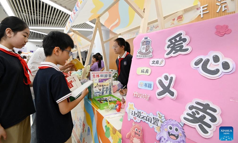 Students take part in a charity bazaar in Handan City, north China's Hebei Province, May 30, 2026. Various events are held across the country to celebrate the upcoming International Children's Day. (Photo by Hao Qunying/Xinhua)