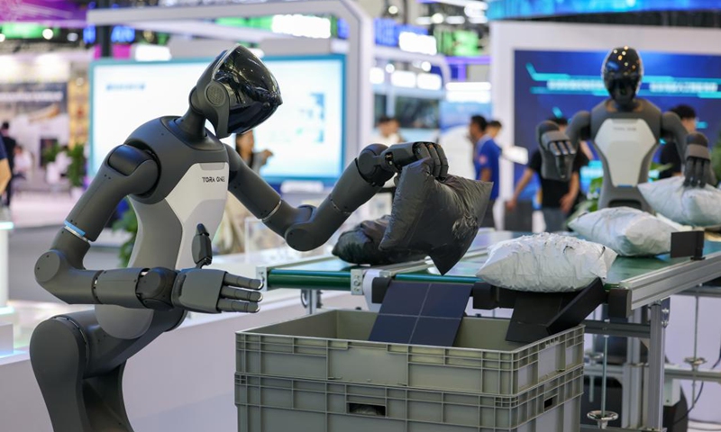 A humanoid robot of PaXini, a haptic technology and humanoid robotics company, demonstrates its package gripping ability at the World Intelligence Expo 2026 in Tianjin, north China, May 28, 2026. (Xinhua/Sun Fanyue)