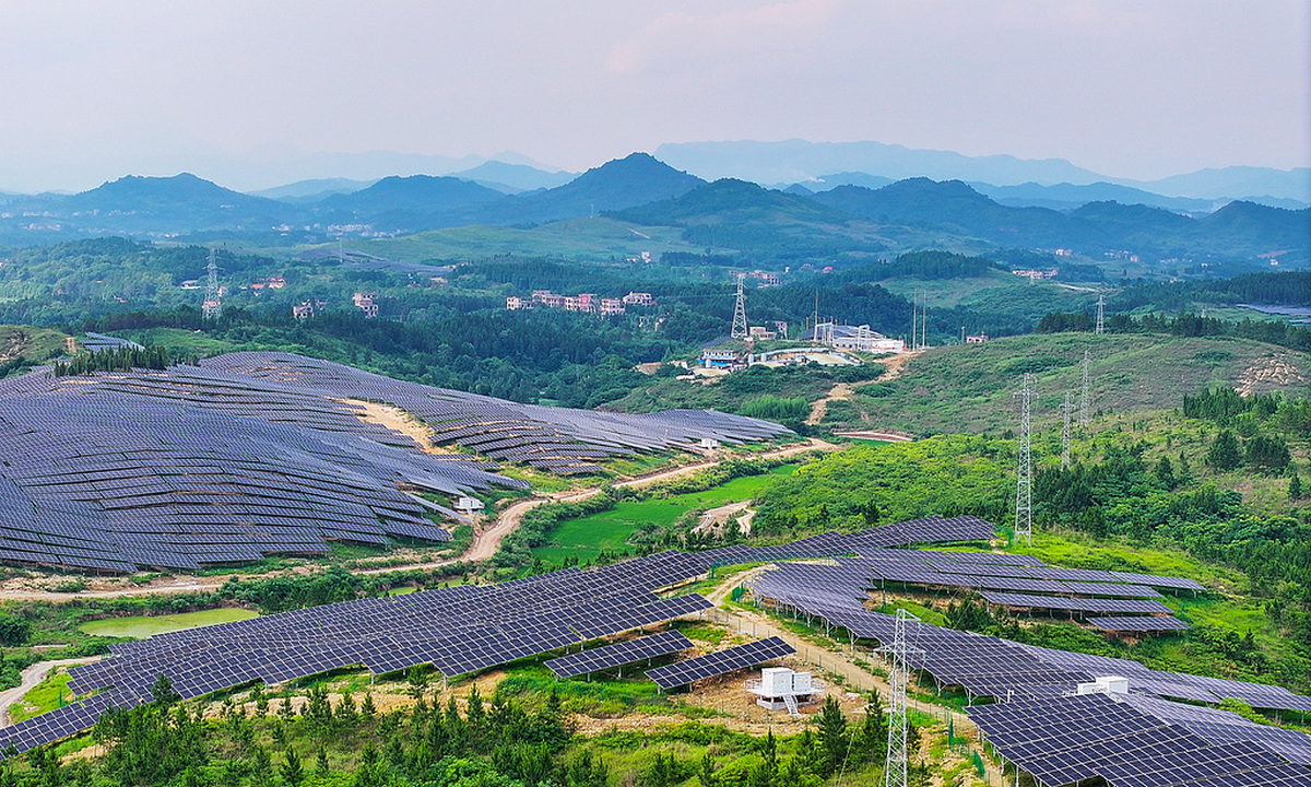 Neatly arranged photovoltaic (PV) panels complement green hills, trees, farmland and village houses, painting a vivid picture of green rural development in Xintian county, Yongzhou, Central China's Hunan Province on June 1, 2026. The county has introduced multiple forestry-solar and agriculture-solar complementary PV projects to improve the comprehensive utilization of natural resources, boost local economy. Photo: VCG