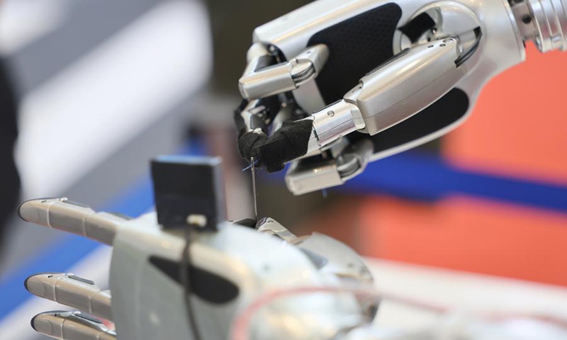 A robot threads a needle at the World Intelligence Expo 2026 in Tianjin, north China, May 28, 2026. (Xinhua/Li Ran)