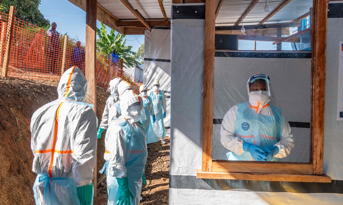 Health workers stand in a new Ebola treatment center during a visit of Tedros Adhanom Ghebreyesus, Director-General of the World Health Organization (WHO), in Bunia, in the northeastern Democratic Republic of the Congo, on May 31, 2026. Photo： VCG