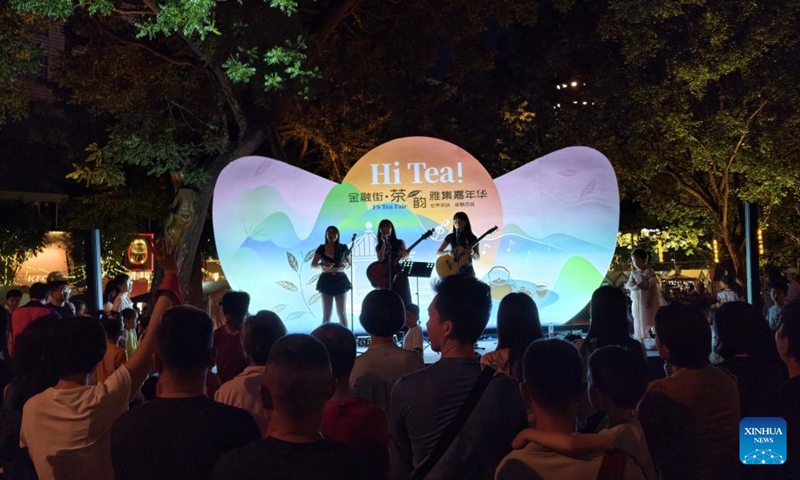People watch a performance during a tea fair in the Financial Street community of Beijing, capital of China, May 30, 2026. The event is held from May 28 to 31 in Xicheng District of Beijing. (Xinhua/Xing Guangli)
