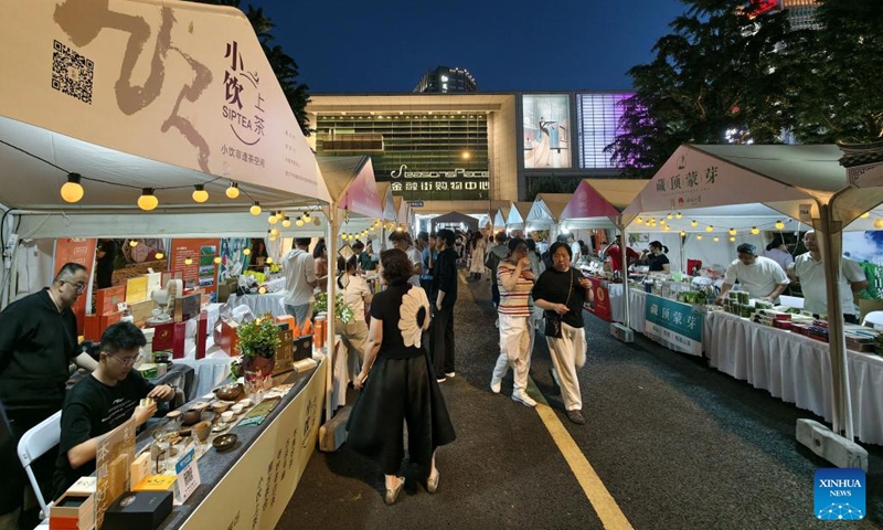 People attend a tea fair in the Financial Street community of Beijing, capital of China, May 30, 2026. The event is held from May 28 to 31 in Xicheng District of Beijing. (Xinhua/Xing Guangli)