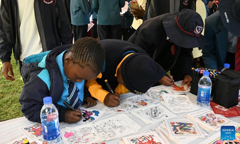 Zimbabwean students paint at the Chinese Embassy in Harare, Zimbabwe, on May 29, 2026. Scores of students from schools across Zimbabwe on Friday experienced Chinese culture at the Chinese Embassy in Zimbabwe during a joint celebration of International Children's Day, which is observed annually on June 1.(Xinhua/Xu Zheng)